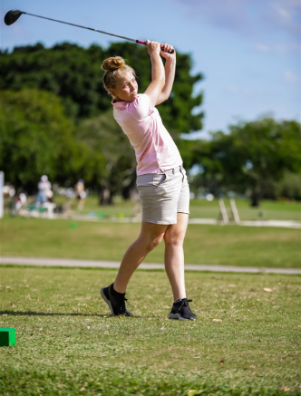 Girls Golf player swinging club